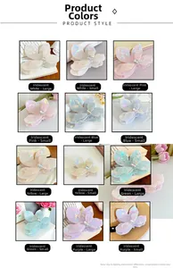 Macro display of triangular flower hair claws in iridescent colors and two sizes