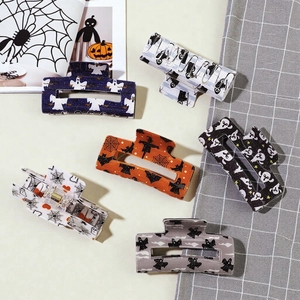 Set of six Halloween acetate hair claws featuring bats, ghosts and pumpkin patterns