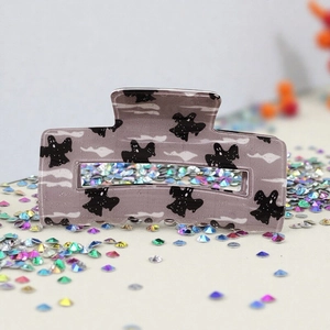 Halloween ghost pattern hair claw clip in translucent purple acetate with glitter details