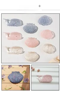 Detailed macro view of whale and seashell hair clips with sparkling sequins and rhinestones
