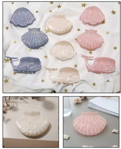 Detailed close-up of shell and whale hair claws with colorful shimmering acetate finish