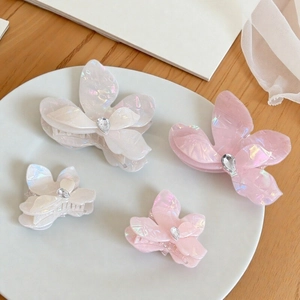 Iridescent butterfly hair claws in white and pink pearl finish with crystal inlay