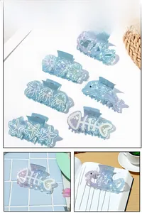 Macro detail of ocean-themed hair clips set with iridescent shell and starfish designs