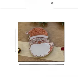 Macro view of Santa Claus hair claw clip showing fine red glitter finish and product dimensions