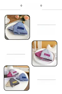 Detail showing high-quality striped fabric hair clip with a moon smiley face logo label