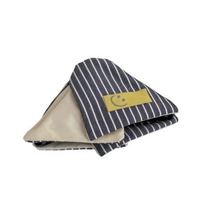 Blue and white striped fabric shark hair clip with a minimalist yellow smiley face patch