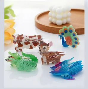 Detail showing colorful PVC animal hair claws including cow, deer, and crocodile designs