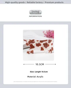 Detail view of 10.5cm acrylic hair claw clip with brown and white cow print texture