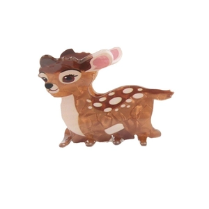Cute amber deer-shaped acetate hair claw clip with white spots on white background