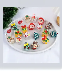 Detailed macro view of assorted Christmas hair clips including Santa and reindeer icons