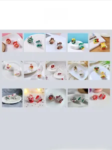 Mini Christmas hair claw clips set with Santa, elk and snowman designs in 15 styles