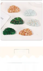 Set of 6 leaf-shaped acetate hair claws with marble texture and golden vein details