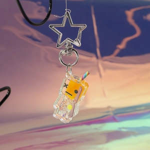 Detailed close-up of a glowing bottle keychain with orange liquid and star-shaped clip