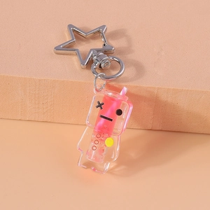 Detail of pink liquid drink keychain with star-shaped silver clasp and acrylic finish