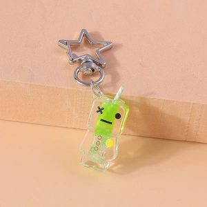 Close-up of a creative robot keychain with green gradient resin and a silver star clasp