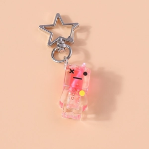 Detailed view of pink liquid keychain with star-shaped silver clasp and glitter sand