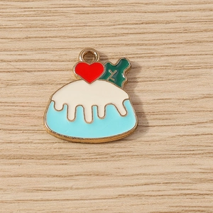 Detail of Christmas blue pudding enamel pendant with red heart and holly leaf accent