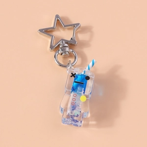 Detailed view of creative luminous drink keychain with blue liquid and star clasp