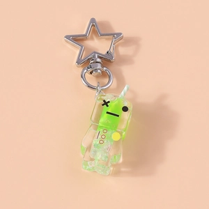 Detailed macro view of green luminous drink charm with star-shaped silver metal clasp