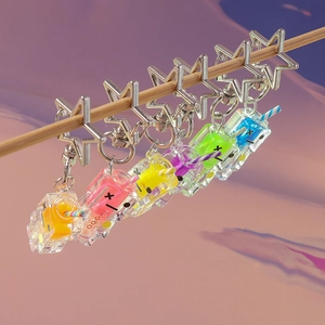 Close-up of 6 colorful acrylic drink carton keychains with silver star-shaped metal rings