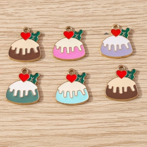 Flat lay of colorful Christmas pudding alloy pendants with red hearts on wood background