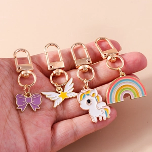 Porte-clés Mignon en Émail Licorne Arc-en-ciel Nœud Étoile Aile Alliage de Zinc Or Goutte d'Huile Pendentif Sac Cadeau Femmes Filles