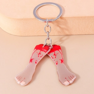 Close-up of Halloween keychain featuring severed feet with realistic blood splatter details
