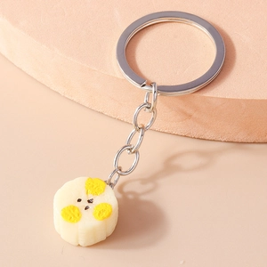 Detailed close-up of a creative simulation pastry keychain with a cute yellow accent