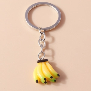 Detailed view of creative banana bunch keychain with vibrant yellow resin and silver ring