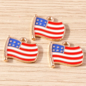 Detail of three USA flag star pendants with gold trim and colorful enamel finish
