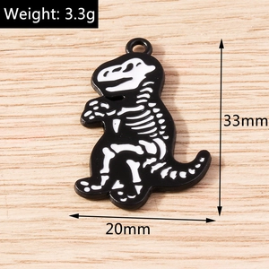 Macro shot of 33mm dinosaur skeleton enamel pendant showing 3.3g weight and dimensions