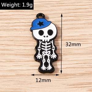 Detail view of skeleton girl pendant with blue star hat and dimensions 32mm by 12mm