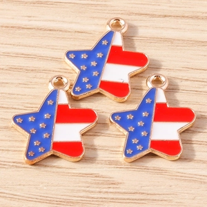 Detail of star-shaped American flag pendants with gold plating on wood background