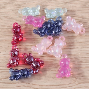 Detail of colorful resin gummy bear charms with hanging hooks for DIY jewelry projects