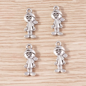 Detail showing cartoon boy metal charms in antique silver finish for DIY jewelry