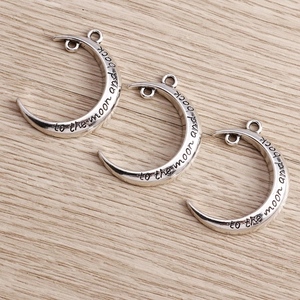 Eight pack of antique silver crescent moon pendants with to the moon and back engraving