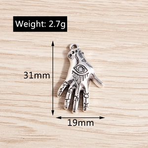 Detail of Hamsa Hand and Evil Eye alloy pendant showing 31mm size and 2.7g weight