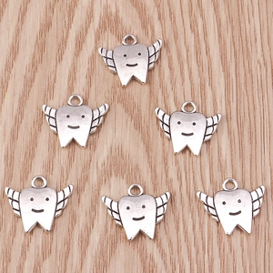 Set of retro silver tooth charms with angel wings and smiley face for DIY jewelry