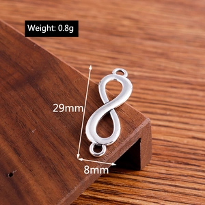 Polished infinity symbol connector for jewelry with dimensions 29mm by 8mm and 0.8g weight