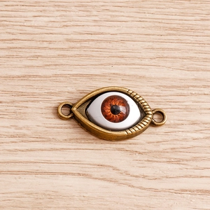 Detail showing bronze evil eye connectors for DIY bracelets and necklaces jewelry making