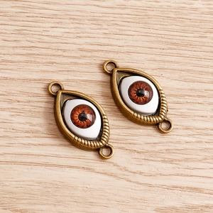 Set of 8 creative 3D devil eye pendants with antique bronze alloy frames for DIY jewelry