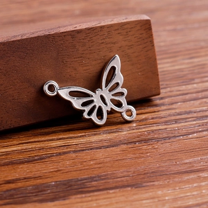 Pack of 20 minimalist silver hollow butterfly charms with double hanging loops for DIY jewelry