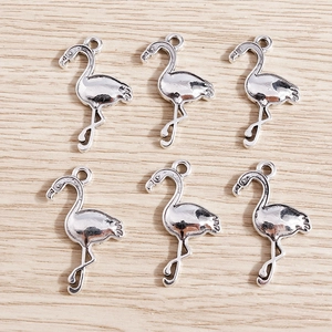 Set of six silver flamingo pendants with textured feather details and loops for jewelry