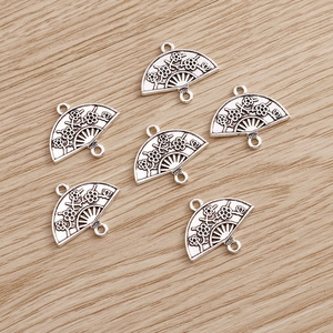 Vintage silver hollow fan pendant with plum blossom patterns for DIY jewelry making