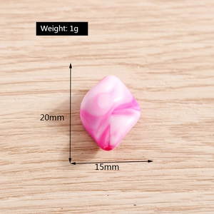 Macro detail of a 20mm pink marble effect irregular candy bead with size labels