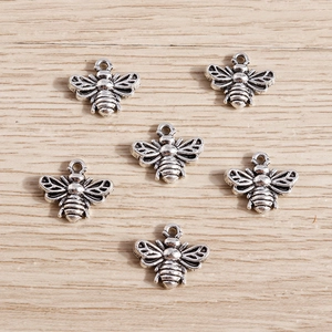 Set of six antique silver bee pendants with detailed wings for DIY jewelry making
