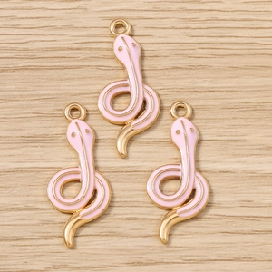Pink enamel snake charms with gold plated edges for DIY jewelry making and pendants