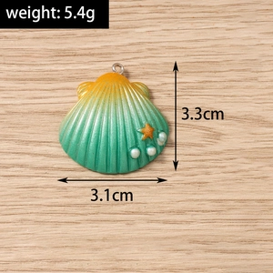 Detailed shell-shaped pendant with gradient colors, pearls, and star charm on wood background