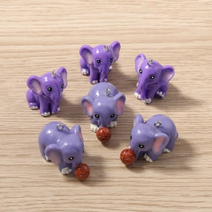 Detailed view of six cute purple elephant charms with metal rings for jewelry making