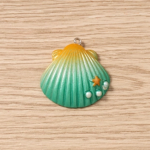 Detail of gradient seashell pendant with orange star and white pearls for DIY jewelry